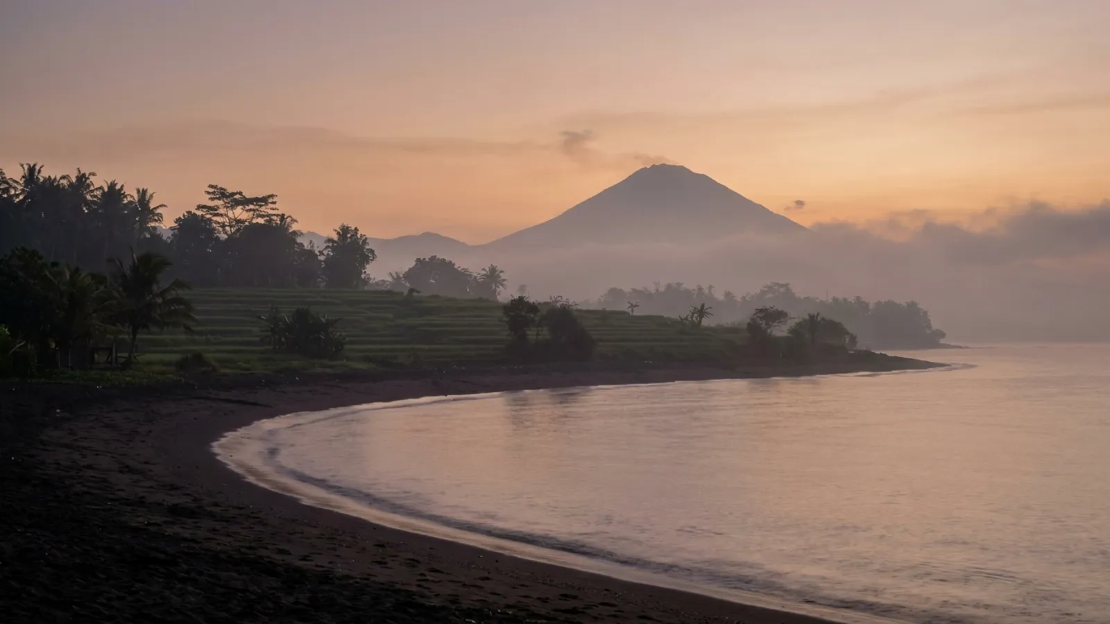 Panoramic view of Tenerife's volcanic landscape and coastline at sunrise